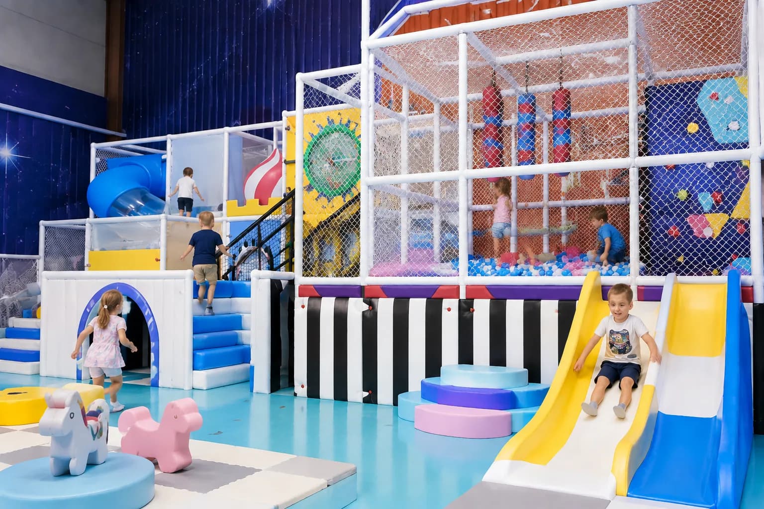 Commercial indoor playground with slides, climbing activities and soft play equipment